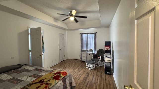 312 Pappy Dr, Oak Grove, KY 42262 - bedroom with dark wood-type flooring, a raised ceiling, baseboards, a textured ceiling, and ceiling fan