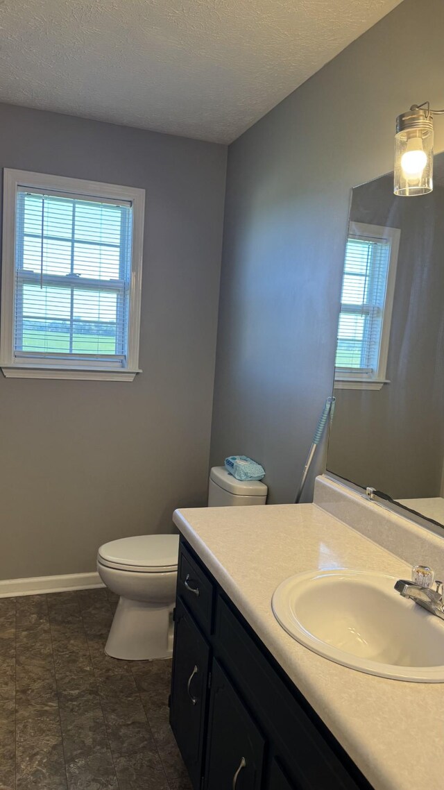 312 Pappy Dr, Oak Grove, KY 42262 - bathroom featuring toilet, vanity, a textured ceiling, and baseboards