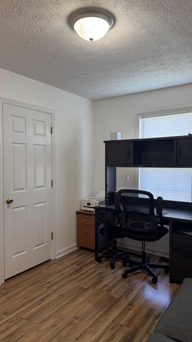 312 Pappy Dr, Oak Grove, KY 42262 - home office with wood finished floors, a textured ceiling, and baseboards