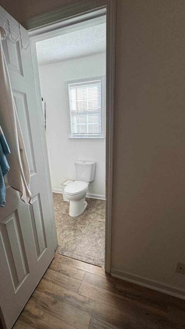 312 Pappy Dr, Oak Grove, KY 42262 - bathroom featuring toilet, wood finished floors, and baseboards