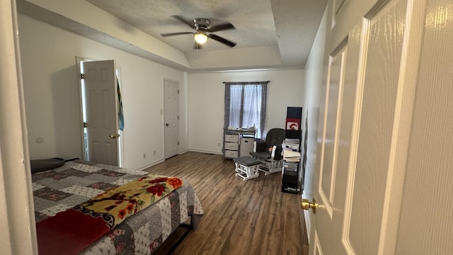 312 Pappy Dr, Oak Grove, KY 42262 - bedroom featuring dark wood-style flooring, a tray ceiling, a ceiling fan, and baseboards