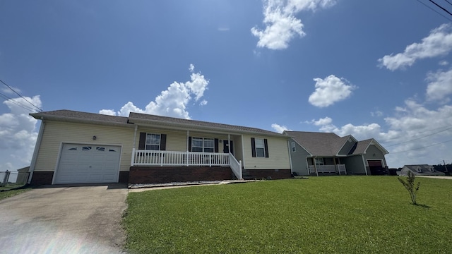 312 Pappy Dr, Oak Grove, KY 42262 - ranch-style house with covered porch, a garage, driveway, a front yard, and crawl space