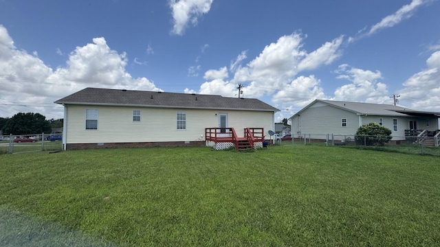 312 Pappy Dr, Oak Grove, KY 42262 - back of property featuring crawl space, a fenced backyard, a deck, and a shingled roof
