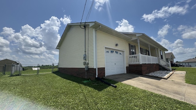 312 Pappy Dr, Oak Grove, KY 42262 - view of property exterior featuring a garage, a porch, driveway, and a gate