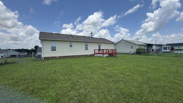 312 Pappy Dr, Oak Grove, KY 42262 - rear view of property featuring a fenced backyard, crawl space, a gate, a wooden deck, and a shingled roof
