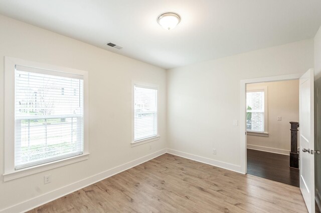 287 Cloverbrook Way, Gallatin, TN 37066 - empty room with wood finished floors, healthy amount of natural light, and baseboards
