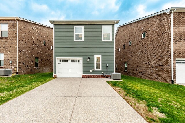287 Cloverbrook Way, Gallatin, TN 37066 - rear view of property with driveway, an attached garage, cooling unit, and a yard
