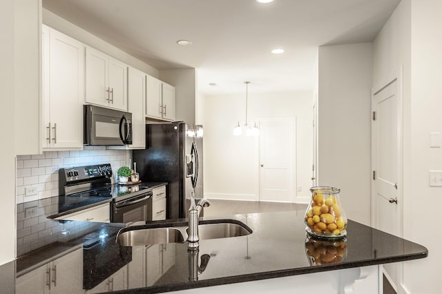 287 Cloverbrook Way, Gallatin, TN 37066 - kitchen featuring black appliances, tasteful backsplash, dark stone counters, white cabinetry, and recessed lighting