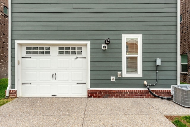 287 Cloverbrook Way, Gallatin, TN 37066 - garage featuring central air condition unit and concrete driveway