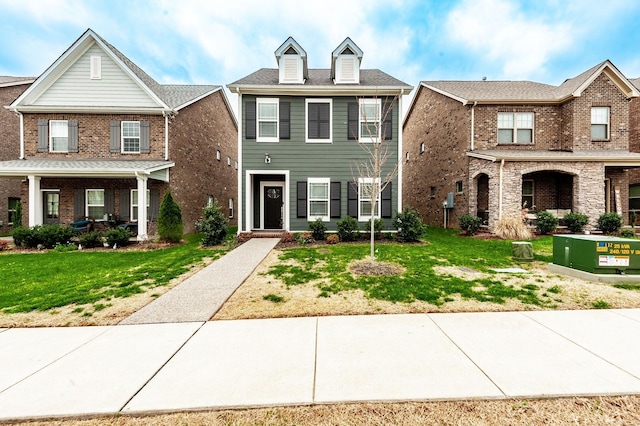 287 Cloverbrook Way, Gallatin, TN 37066 - townhome / multi-family property featuring a front lawn and brick siding