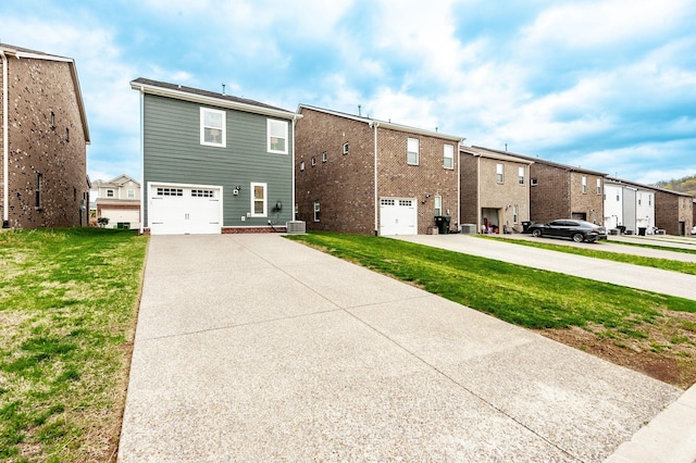 287 Cloverbrook Way, Gallatin, TN 37066 - rear view of property featuring driveway, a garage, a residential view, and a yard