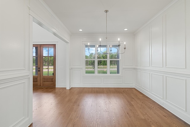 7100 Twelve Corners Rd, Lascassas, TN 37085 - unfurnished dining area featuring a decorative wall, a chandelier, light wood-style floors, ornamental molding, and recessed lighting