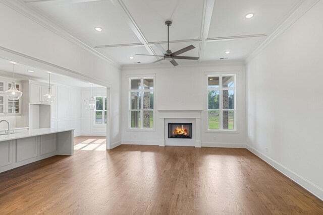 7100 Twelve Corners Rd, Lascassas, TN 37085 - unfurnished living room with coffered ceiling, ceiling fan, wood finished floors, a glass covered fireplace, and baseboards