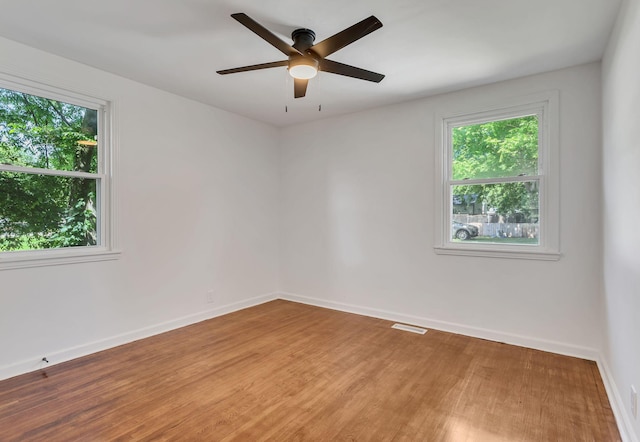 203 Summer St, Mount Pleasant, TN 38474 - empty room with light wood-style flooring, baseboards, and a ceiling fan