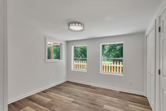 203 Summer St, Mount Pleasant, TN 38474 - unfurnished bedroom featuring wood finished floors and baseboards