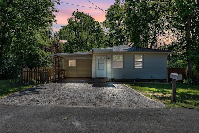 203 Summer St, Mount Pleasant, TN 38474 - view of front of home featuring asphalt driveway, a carport, metal roof, and a standing seam roof