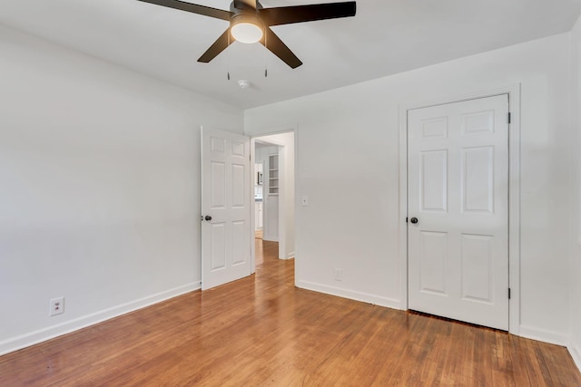 203 Summer St, Mount Pleasant, TN 38474 - unfurnished bedroom featuring light wood-style floors, baseboards, and a ceiling fan