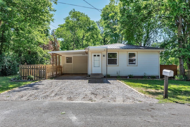 203 Summer St, Mount Pleasant, TN 38474 - view of front of home featuring metal roof, a standing seam roof, driveway, and a carport