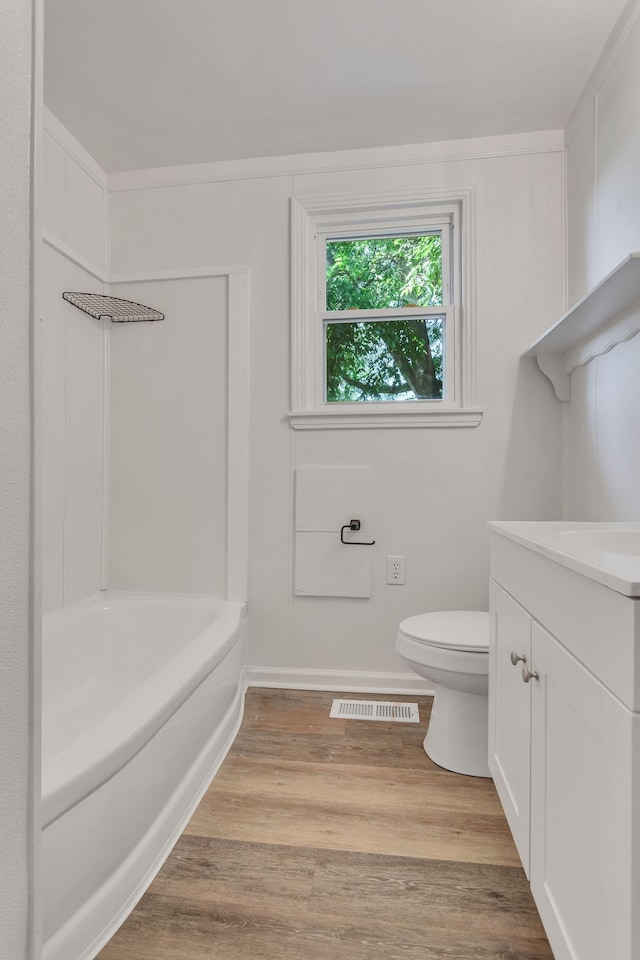 203 Summer St, Mount Pleasant, TN 38474 - bathroom with vanity, toilet, wood finished floors, tub / shower combination, and baseboards