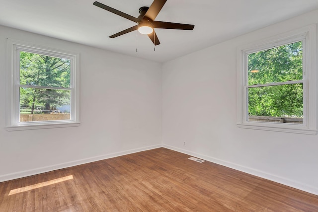 203 Summer St, Mount Pleasant, TN 38474 - unfurnished room with wood finished floors, baseboards, and ceiling fan