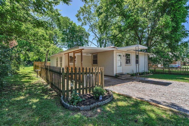 203 Summer St, Mount Pleasant, TN 38474 - rear view of house with an attached carport and driveway