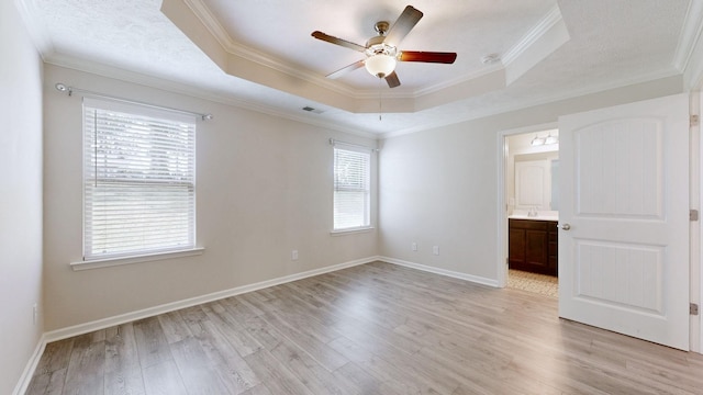 249 Edgefield Ct, Pleasant View, TN 37146 - unfurnished room with a raised ceiling, ceiling fan, healthy amount of natural light, light wood-style floors, and crown molding