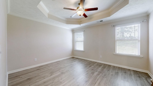 249 Edgefield Ct, Pleasant View, TN 37146 - unfurnished room with light wood-style flooring, a ceiling fan, a raised ceiling, and crown molding