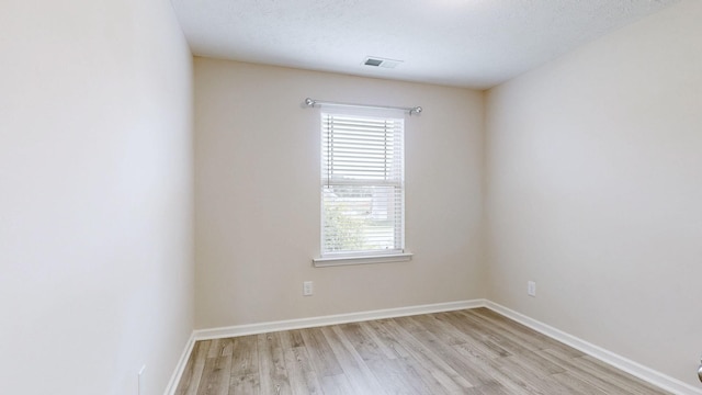 249 Edgefield Ct, Pleasant View, TN 37146 - empty room featuring light wood finished floors and healthy amount of natural light