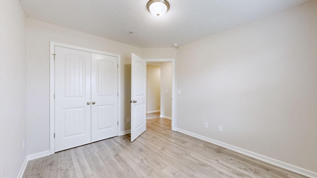 249 Edgefield Ct, Pleasant View, TN 37146 - unfurnished bedroom with light wood-style floors and a closet
