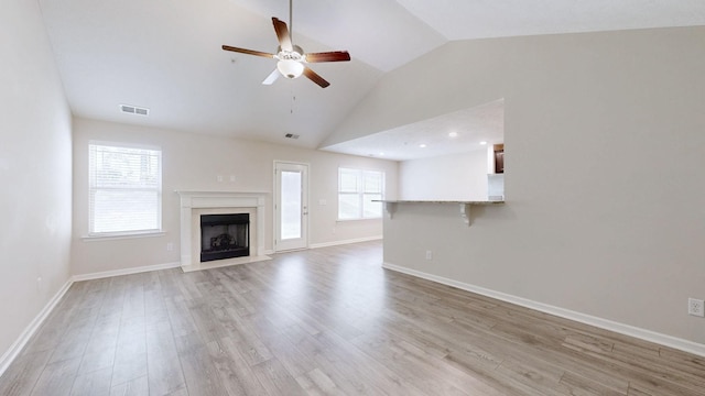 249 Edgefield Ct, Pleasant View, TN 37146 - unfurnished living room with lofted ceiling, a high end fireplace, a ceiling fan, light wood-style floors, and recessed lighting