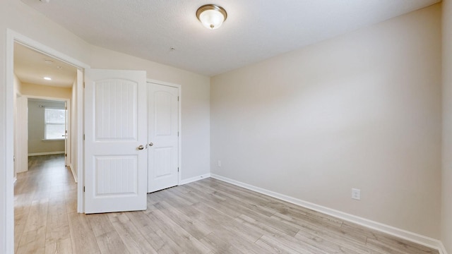 249 Edgefield Ct, Pleasant View, TN 37146 - unfurnished bedroom featuring light wood-style floors and a closet