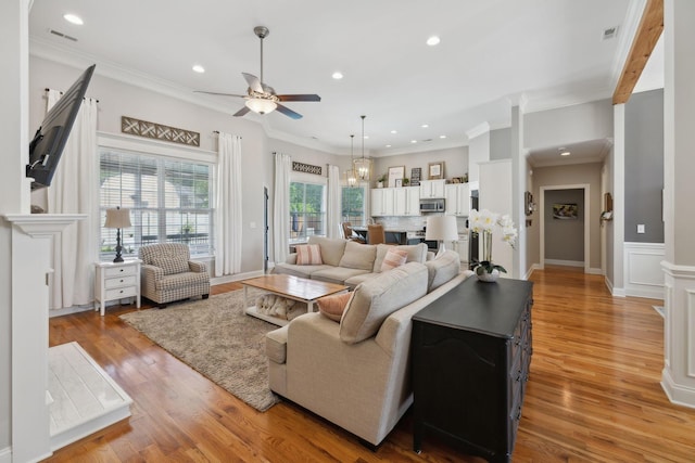 7579 Nightfall Cir, Ooltewah, TN 37363 - living area featuring a ceiling fan, recessed lighting, light wood-style floors, and ornamental molding