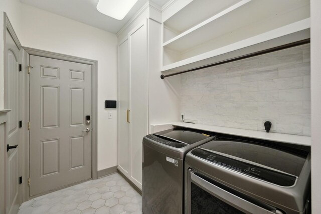 7579 Nightfall Cir, Ooltewah, TN 37363 - laundry area with independent washer and dryer, cabinet space, light tile patterned floors, and baseboards