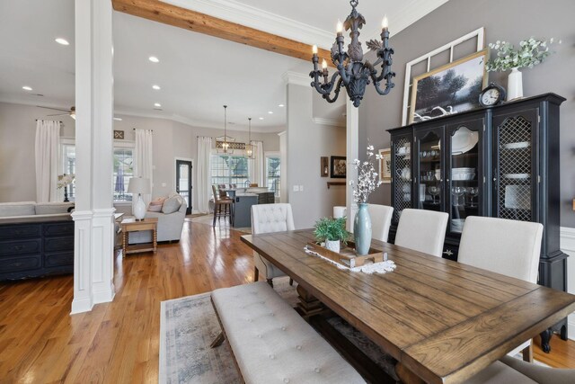 7579 Nightfall Cir, Ooltewah, TN 37363 - dining area with decorative columns, recessed lighting, light wood finished floors, a chandelier, and crown molding