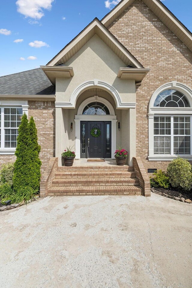 7579 Nightfall Cir, Ooltewah, TN 37363 - entrance to property featuring brick siding and stucco siding