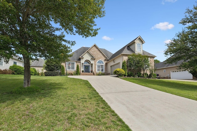 7579 Nightfall Cir, Ooltewah, TN 37363 - view of front of property with an attached garage, a front yard, and driveway