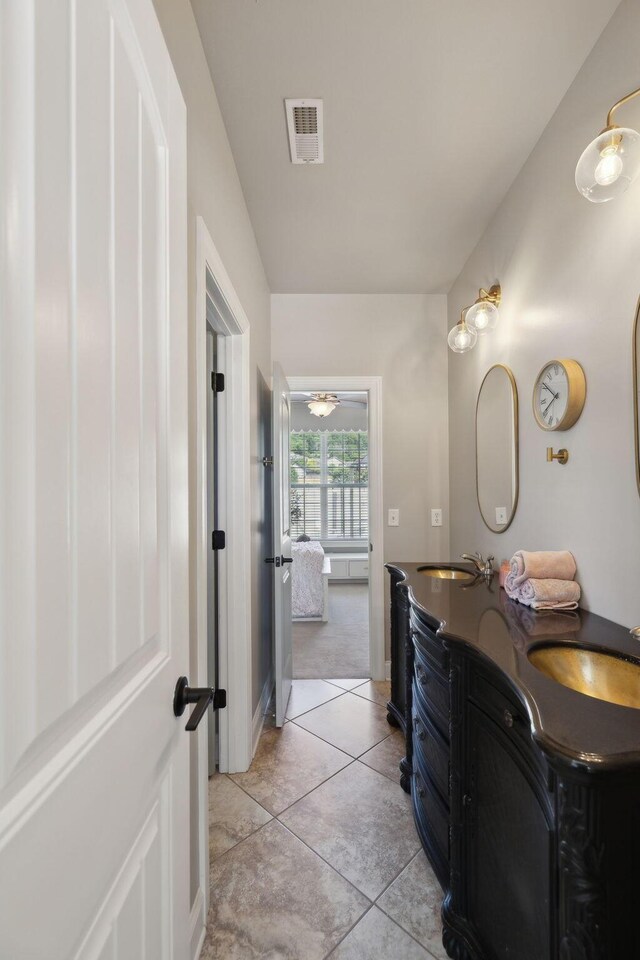 7579 Nightfall Cir, Ooltewah, TN 37363 - bathroom featuring double vanity, tile patterned flooring, and baseboards