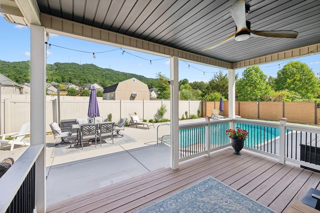 7579 Nightfall Cir, Ooltewah, TN 37363 - wooden deck with a fenced backyard, a patio area, ceiling fan, and outdoor dining area