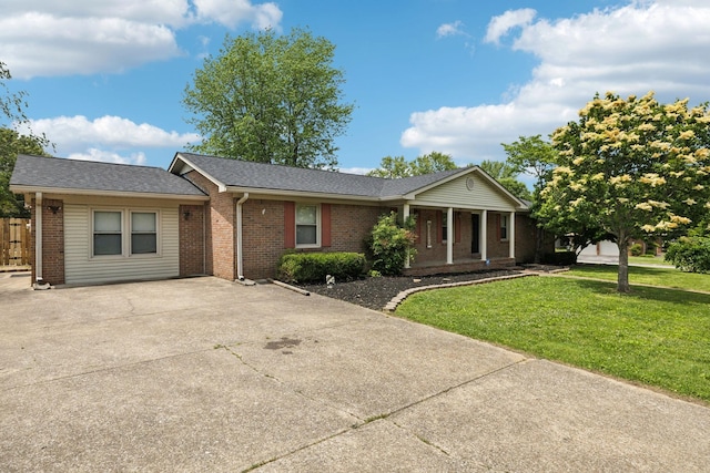 805 Springmont Dr, Hopkinsville, KY 42240 - single story home with brick siding, driveway, a front yard, a porch, and a shingled roof