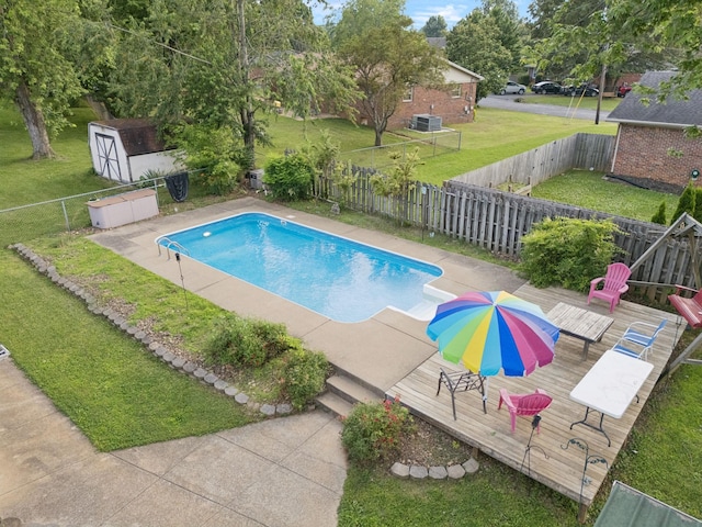805 Springmont Dr, Hopkinsville, KY 42240 - view of swimming pool with a deck, a shed, and a fenced backyard