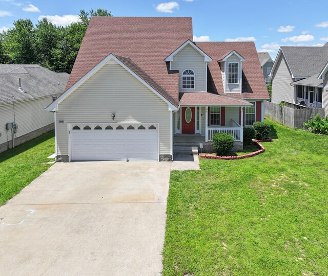 3716 S Jot Dr, Clarksville, TN 37040 - view of front of home with covered porch, driveway, a garage, and a shingled roof
