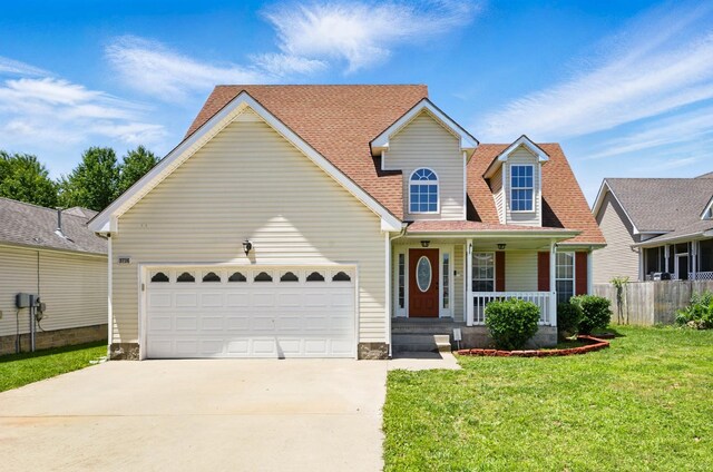 3716 S Jot Dr, Clarksville, TN 37040 - traditional home with covered porch, concrete driveway, and a garage