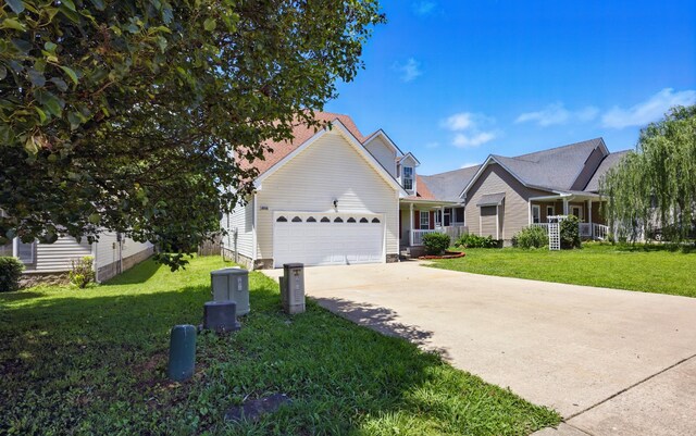 3716 S Jot Dr, Clarksville, TN 37040 - view of front of property featuring a garage, concrete driveway, and a front yard