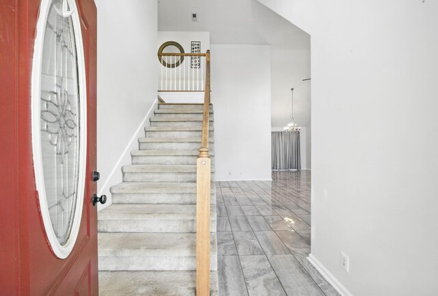 3716 S Jot Dr, Clarksville, TN 37040 - entryway with stairway and a chandelier