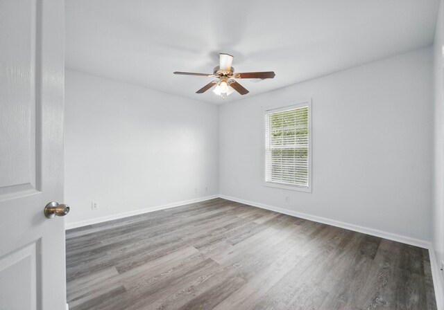 3716 S Jot Dr, Clarksville, TN 37040 - unfurnished room featuring ceiling fan, wood finished floors, and baseboards