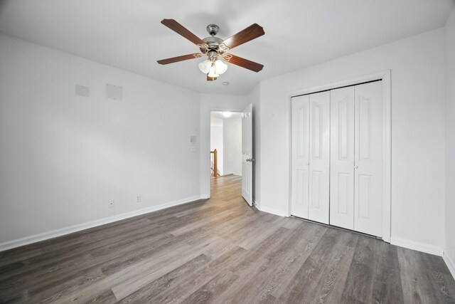 3716 S Jot Dr, Clarksville, TN 37040 - unfurnished bedroom with wood finished floors, baseboards, a closet, and ceiling fan