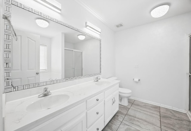 3716 S Jot Dr, Clarksville, TN 37040 - bathroom with a stall shower, double vanity, toilet, and baseboards