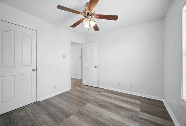 3716 S Jot Dr, Clarksville, TN 37040 - unfurnished bedroom featuring baseboards, wood finished floors, and a ceiling fan