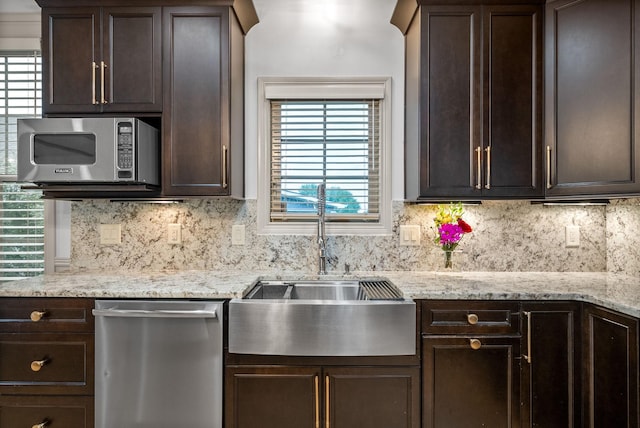 127 Copperstone Dr, Clarksville, TN 37043 - kitchen with stainless steel appliances, a sink, and dark brown cabinets