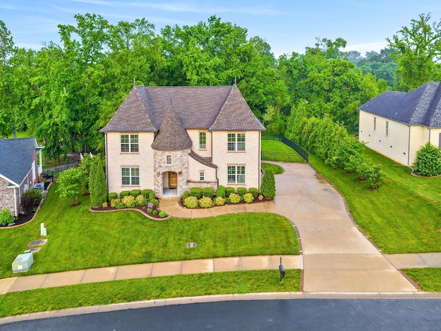 127 Copperstone Dr, Clarksville, TN 37043 - french country inspired facade featuring stone siding, a front lawn, and driveway